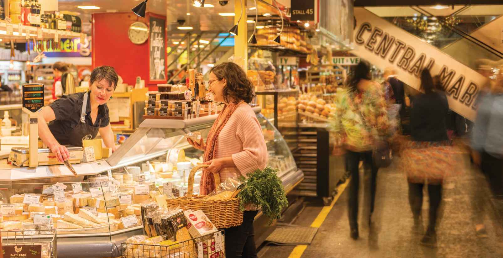 woman buying from a fruit market