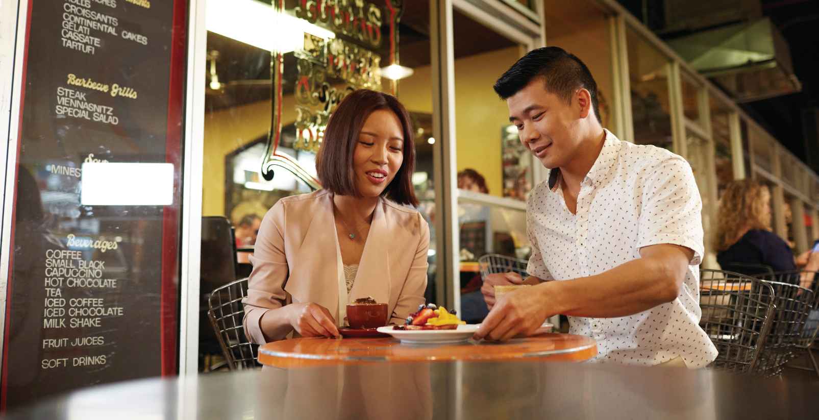 couple eating at a market
